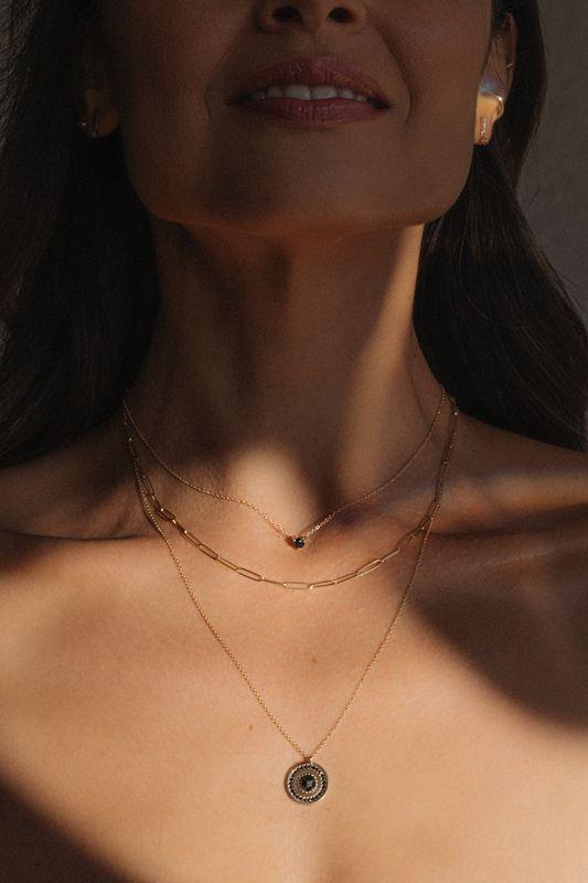 woman with Marrow necklaces