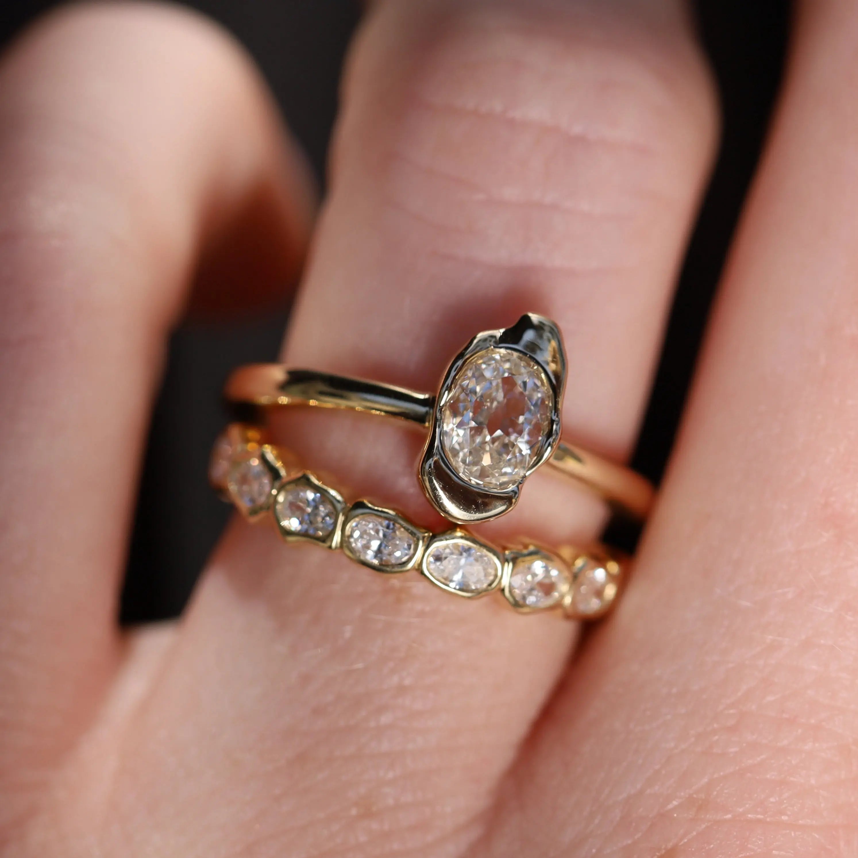 0.40ct Oval Diamond Abstract Bezel Ring on hand