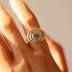 Close up of 1.50ct Pink Sapphire In-Orbit Ring on finger