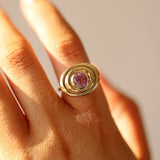 Close up of 1.50ct Pink Sapphire In-Orbit Ring on finger