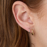 9mm Everyday Hoops and 12mm Everyday Hoops styled on woman's ear, close up