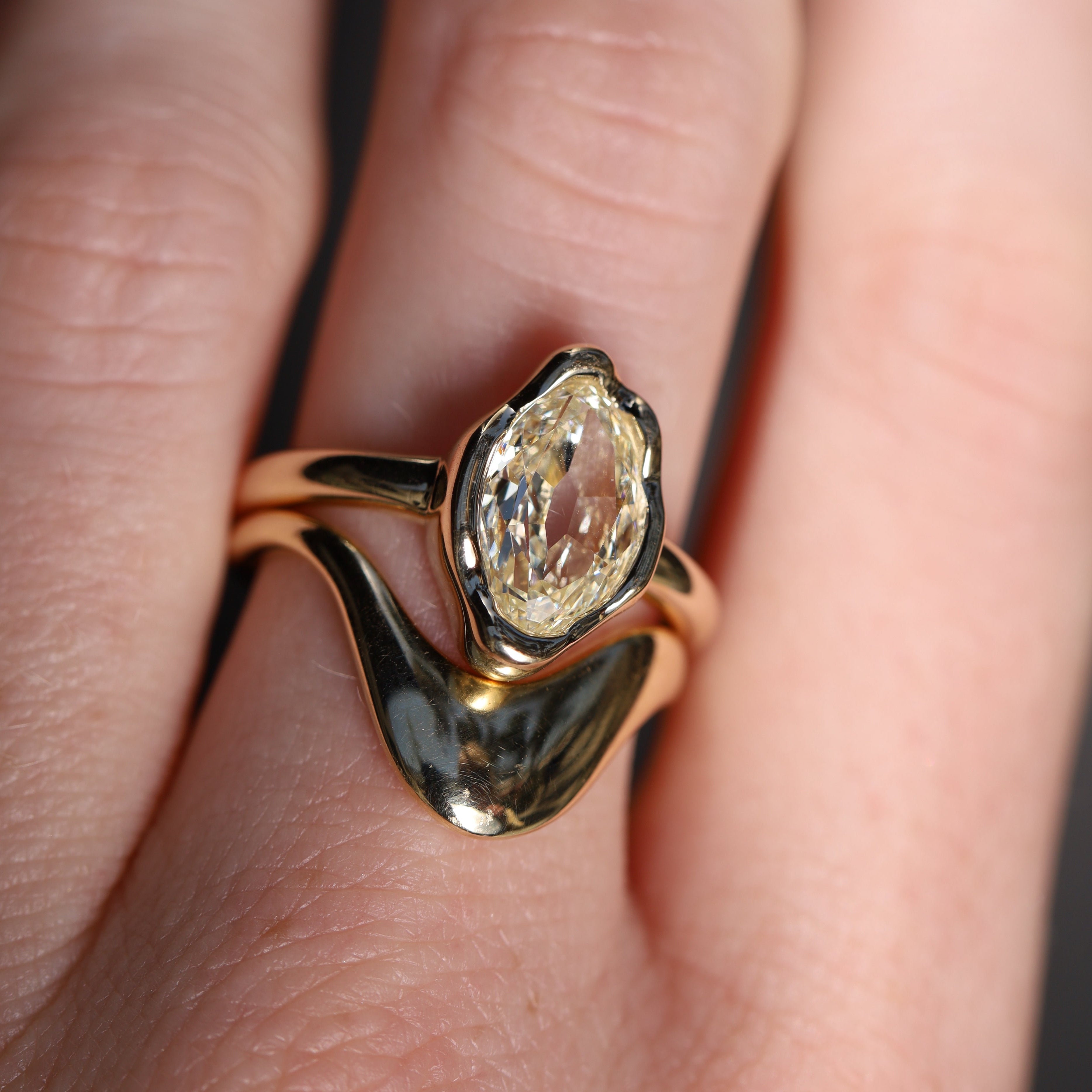 2.01ct Moval Diamond Abstract Bezel Ring on hand