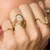 Close up of woman with hands near her face, wearing the Asymmetrical Sculpted Band