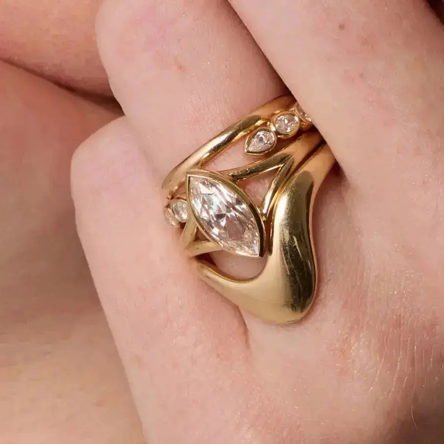 The Colette Marquise Split Shank Engagement Ring close up on hand