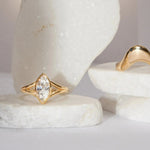 The Colette Marquise Split Shank Engagement Ring flat lay