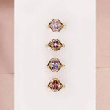 Flat lay of Marrow x Sammi colored gemstone Florence rings
