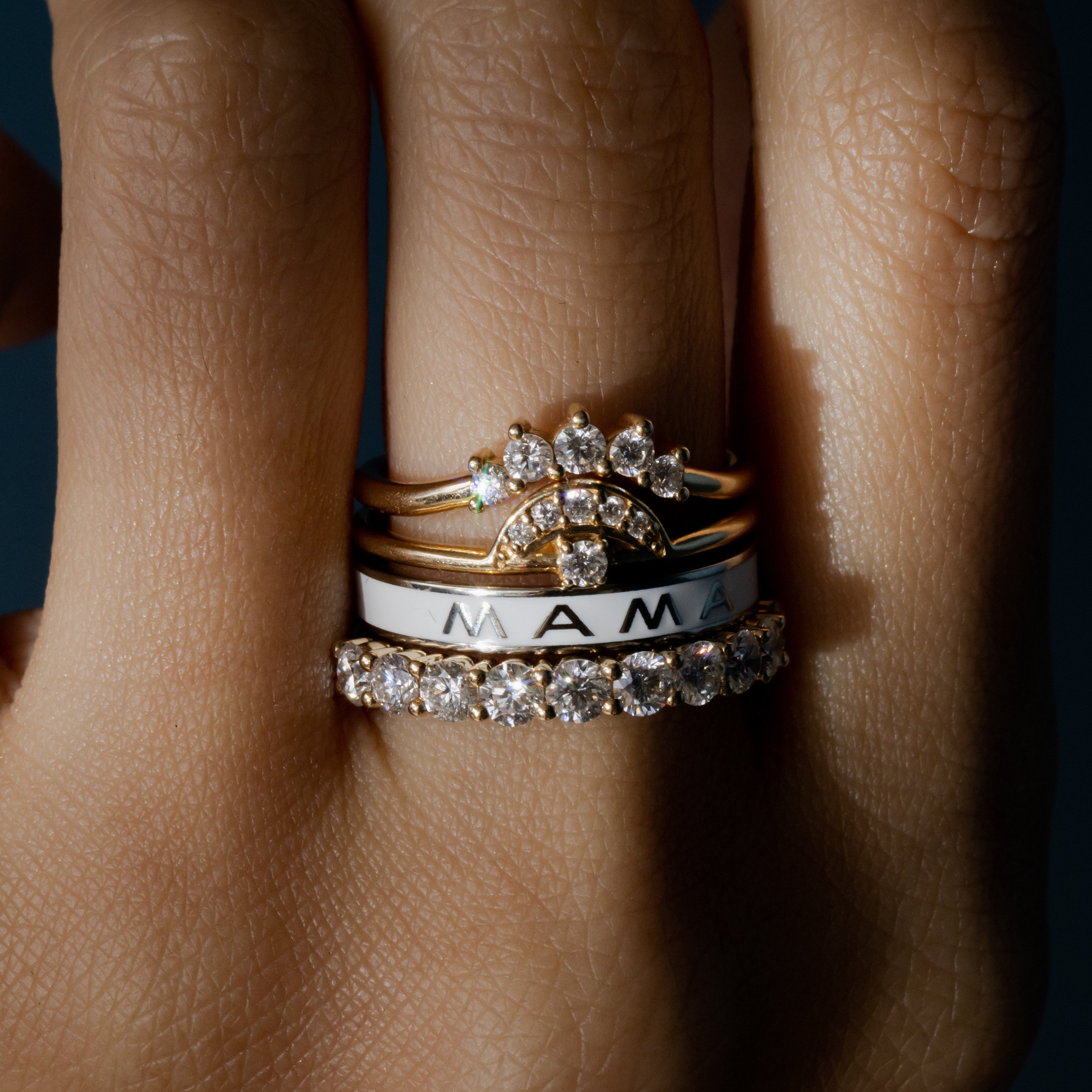 Close up of White Diamond Crown Ring stacked on hand