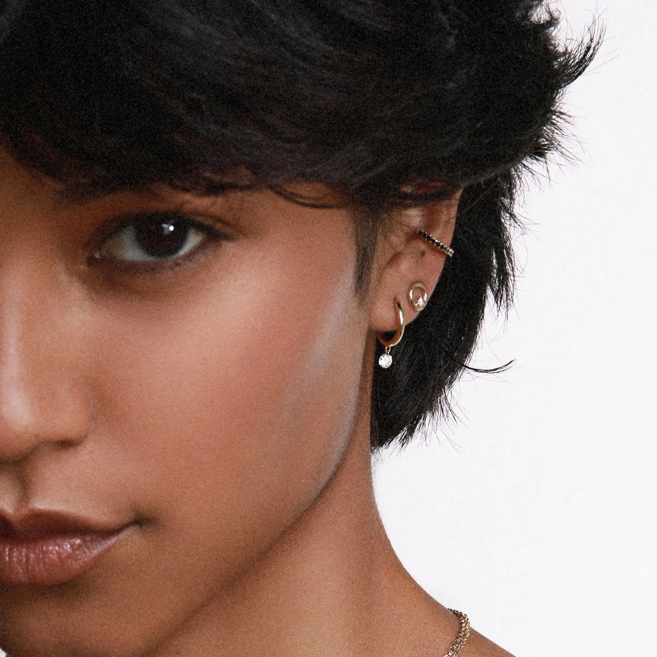 Close up of woman wearing Marrow Fine Diamond Drop Hoops