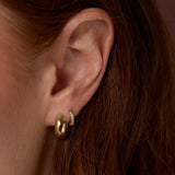 Close up of Mini White Diamond Hoops on ear