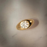 Flat lay birds eye view of Dyllan Round Engagement Ring in yellow gold