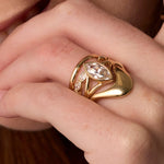 Close up of women's hand featuring multiple Marrow Fine rings styled together