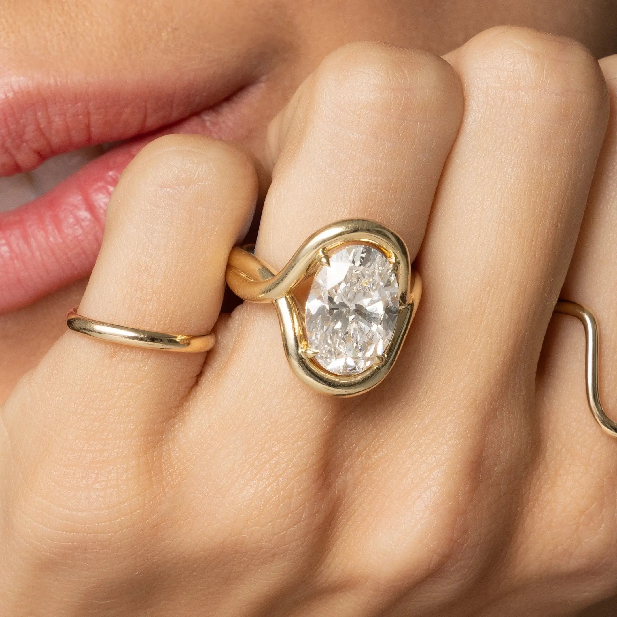 Close up of woman resting hand against her chin featuring the Marrow x Sammi Florence Ring
