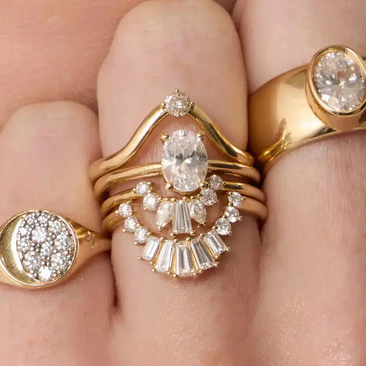 The Helene Oval Solitaire Engagement Ring close up on hand