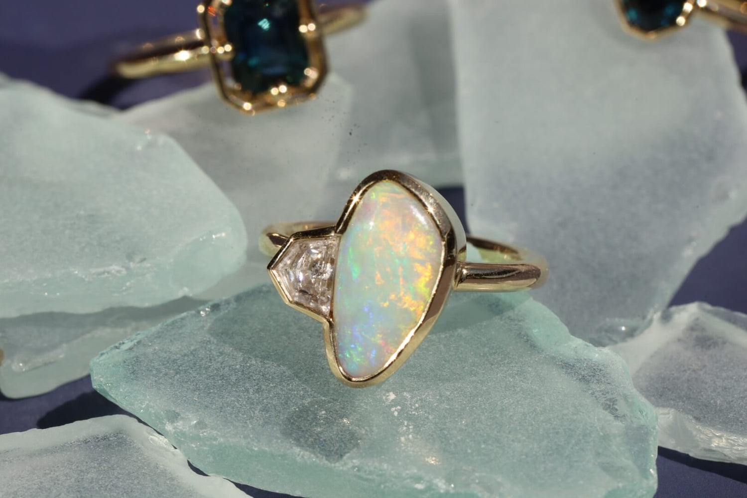 close up of opal and white diamond bezel ring from to the sea collection
