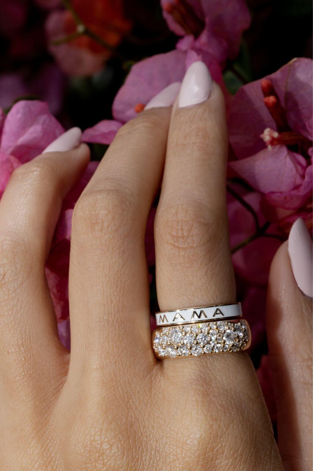 close up of woman's hand wearing our White Mama Enamel Band stacked with a white diamond chunky ring.