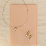 Odette Oval Drop Earrings and Odette Oval Collar flat lay