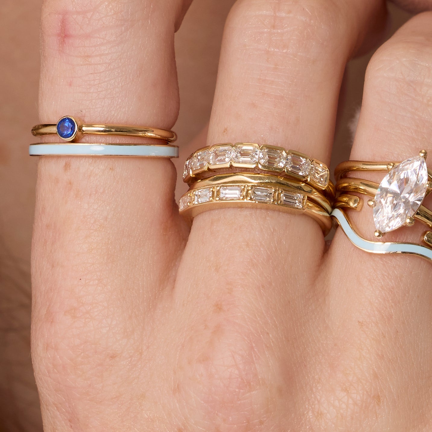 Blue Sapphire Sweet Pea Stacking Ring on hand, close up