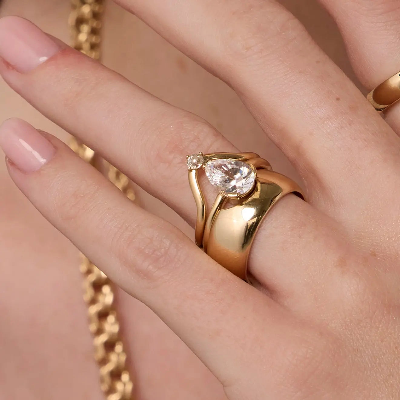 Close up of woman's hand spotlighting various Marrow Fine rings