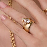 Close up of woman's hand spotlighting various Marrow Fine rings