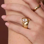 The Sloane Pear Solitaire Engagement Ring, close up on hand