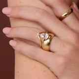 The Sloane Pear Solitaire Engagement Ring, close up on hand