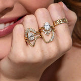 The Sloane Pear Solitaire Engagement Ring, close up on hand