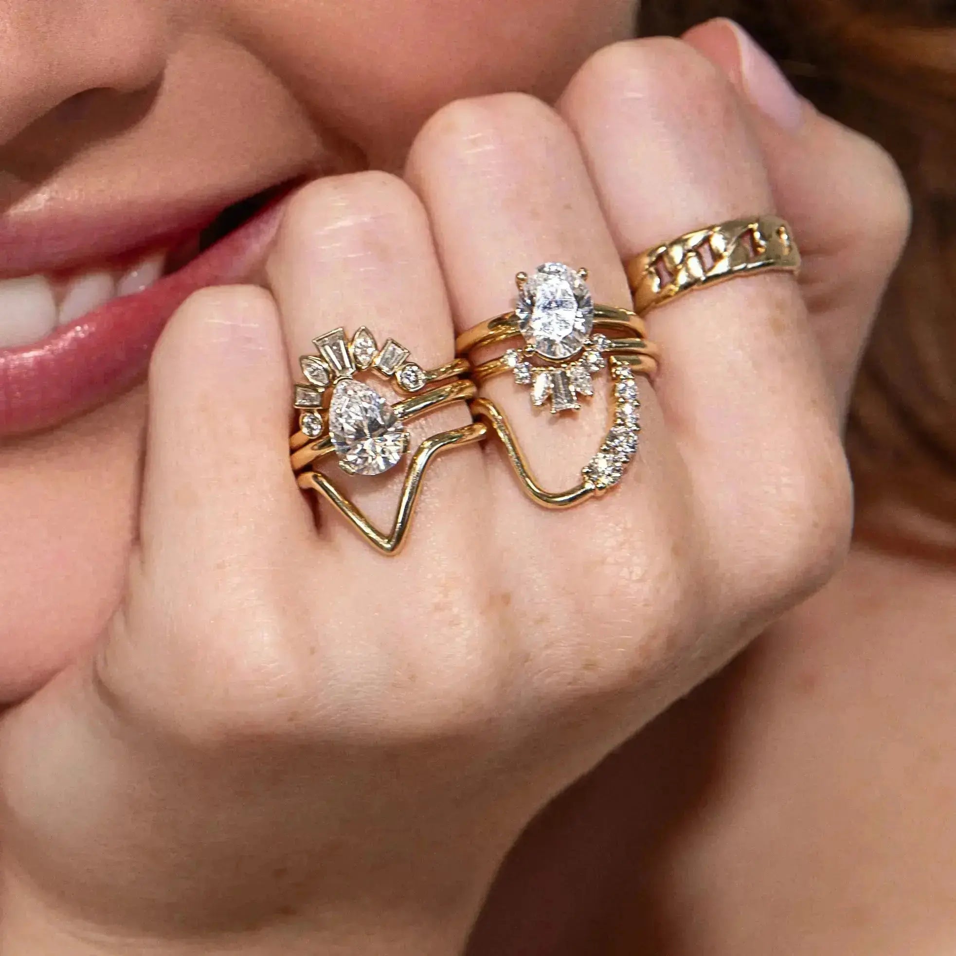 The Sloane Pear Solitaire Engagement Ring, close up on hand