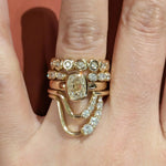 Close up of Marrow Fine Diamond bands stacked on hand