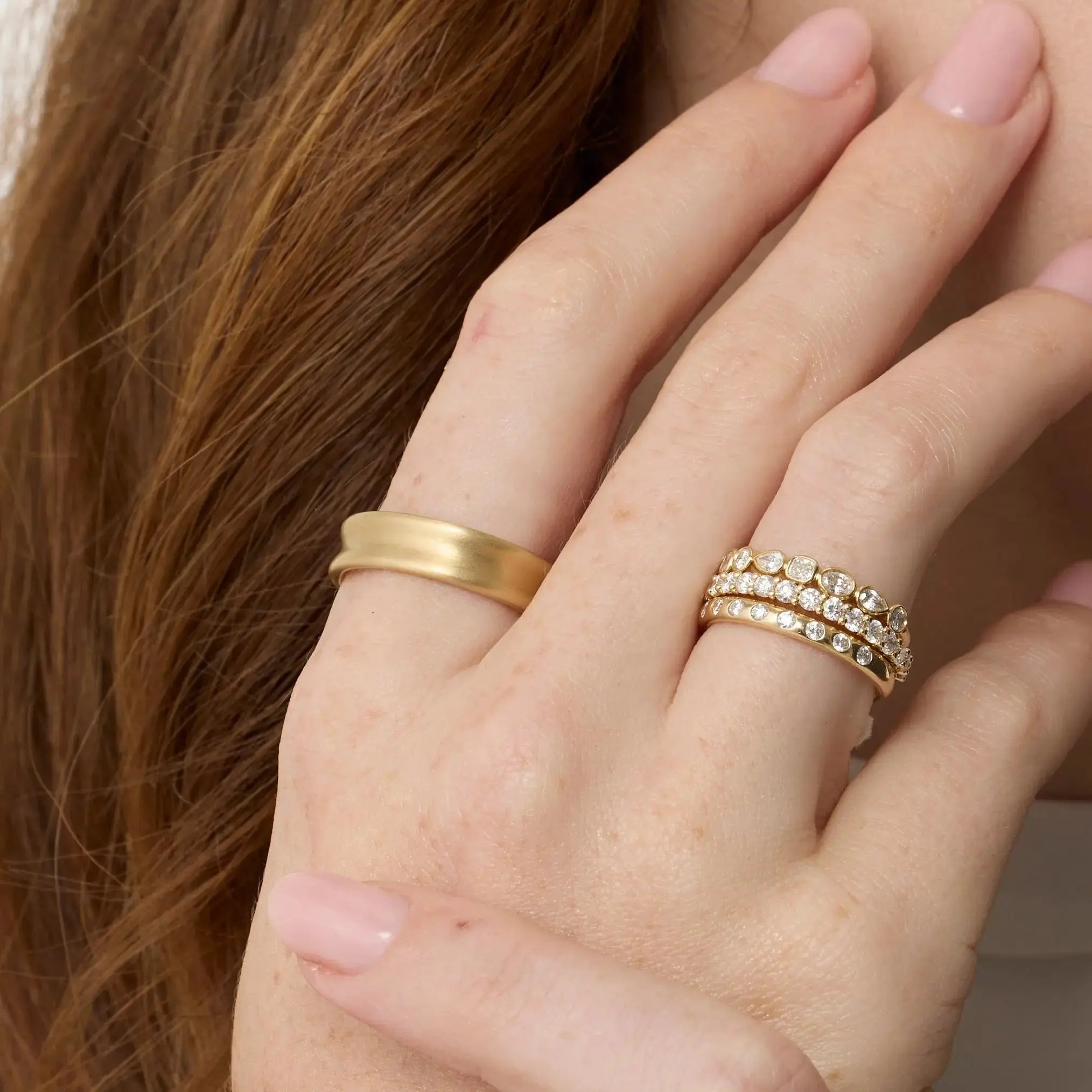 Close up of Everyday Vale Ring styled on hand + other Marrow Fine White Diamond Bands