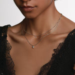 White Diamond Abstract Bezel Necklace close up on woman's décolletage
