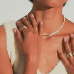 Video of Barely There Pearl Choker on woman's neck