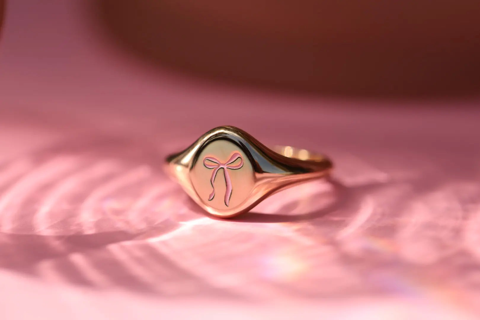 Introducing the Pink Enamel Bow Signet: Supporting Breast Cancer Awareness Marrow Fine