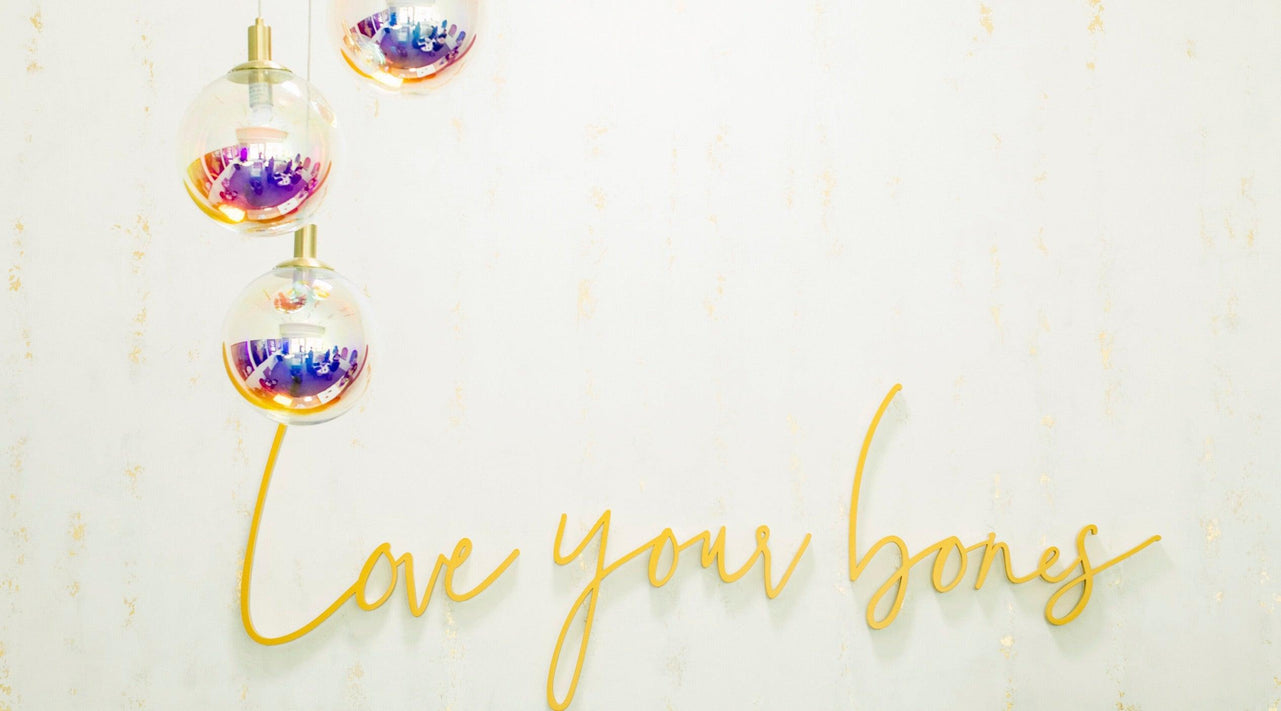close up of 'love your bones' sign