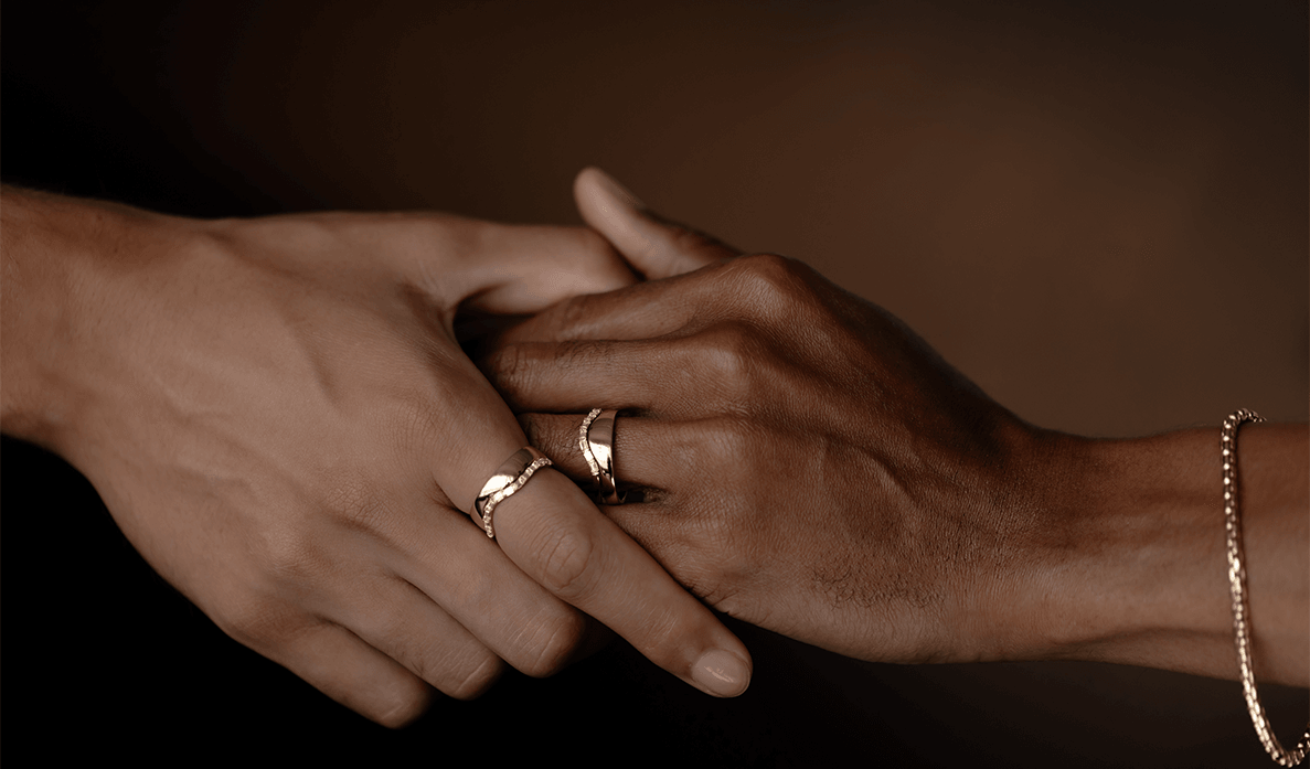 two hands with Marrow rings holding each other