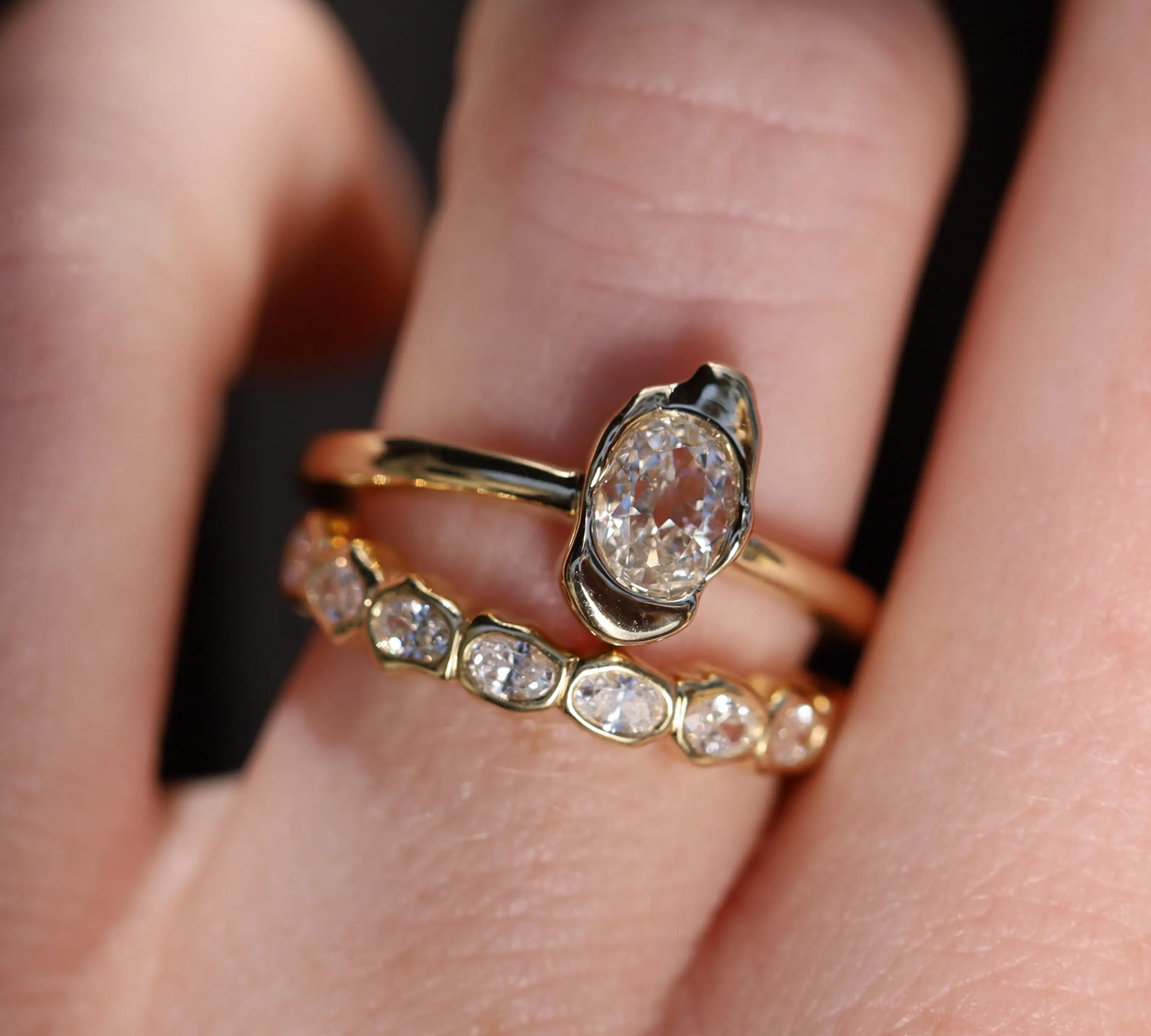 0.40ct Oval Diamond Abstract Bezel Ring on hand