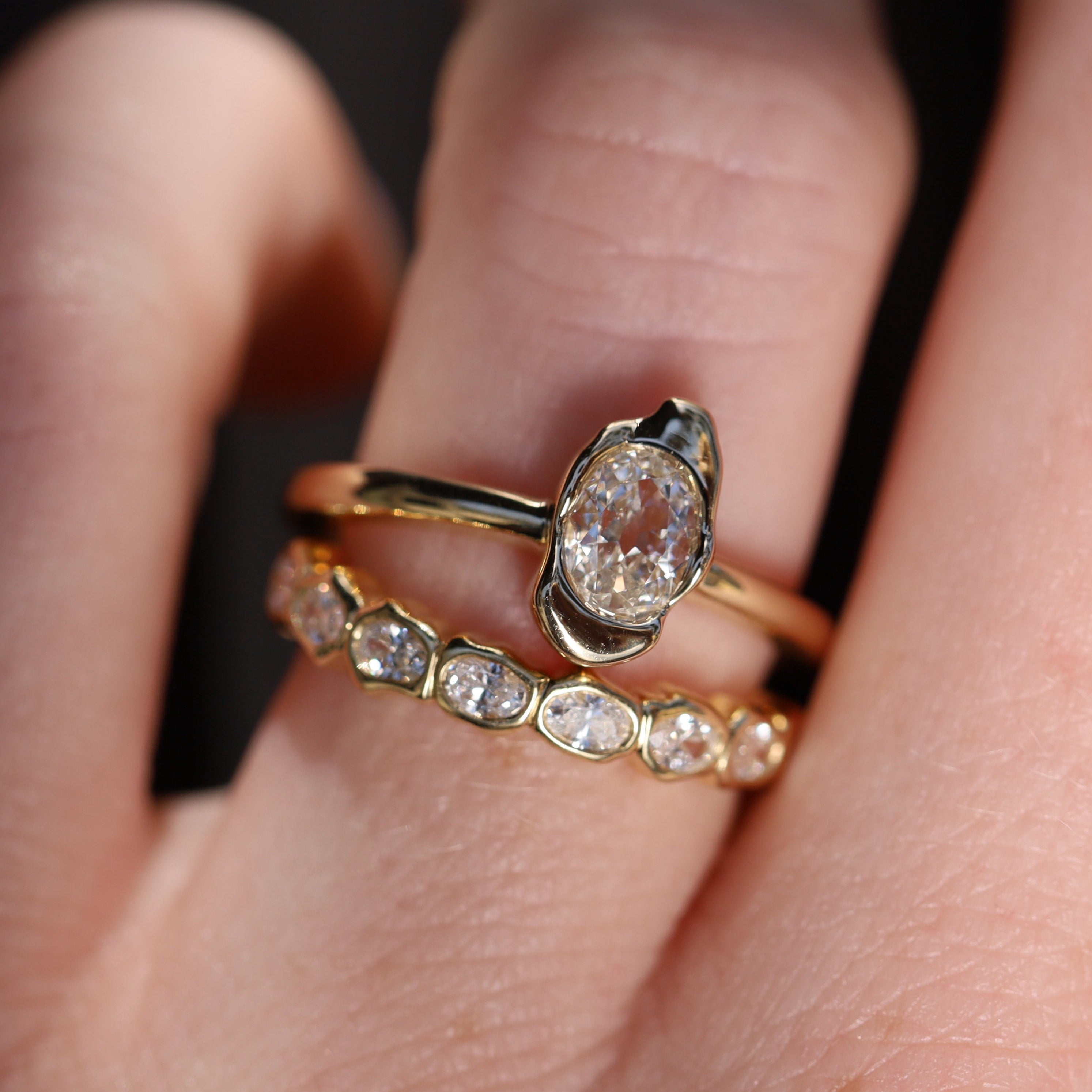 0.40ct Oval Diamond Abstract Bezel Ring on hand