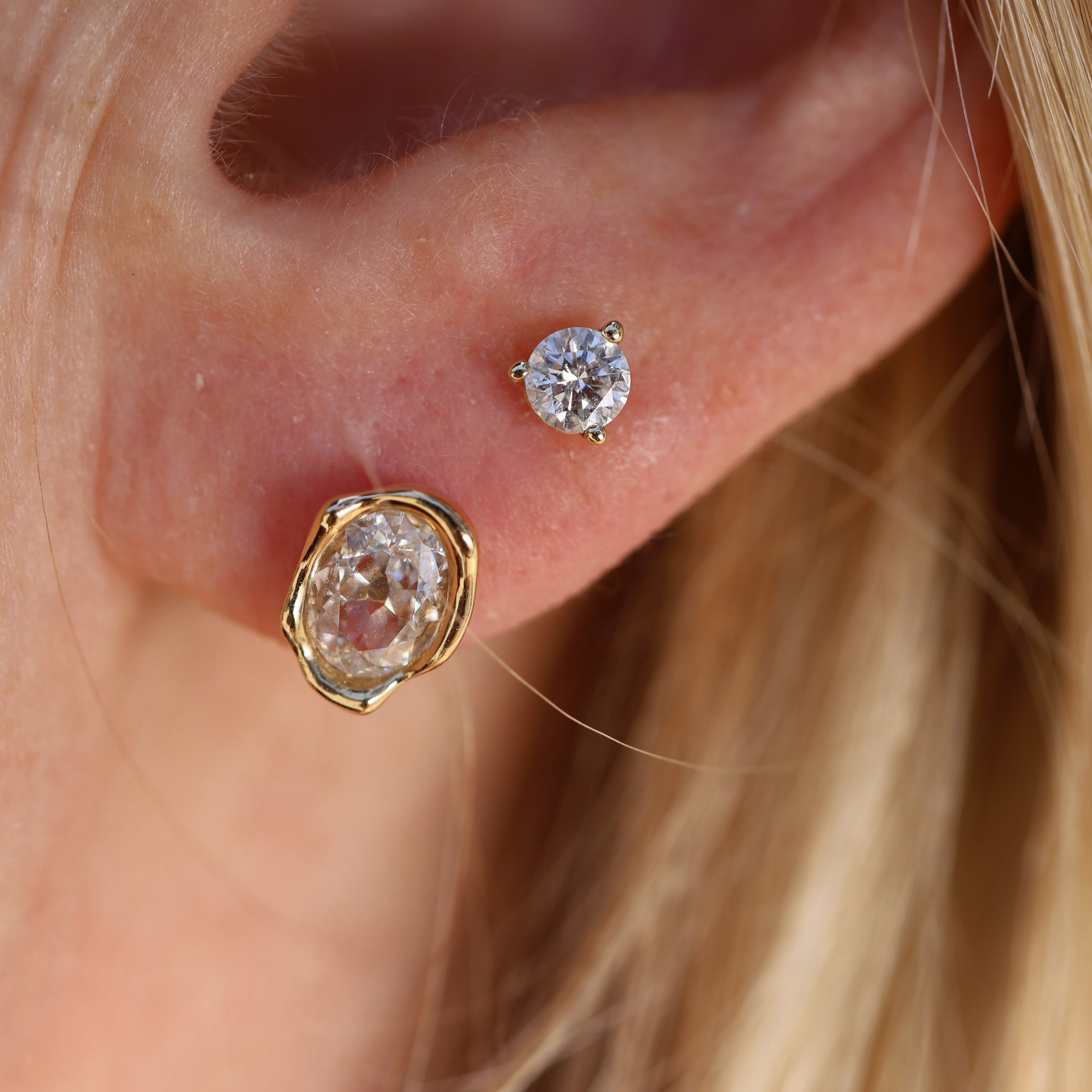 0.99ctw Diamond Abstract Bezel Studs on ear, close up