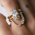 White diamond cushion engagement ring with two stacking bands