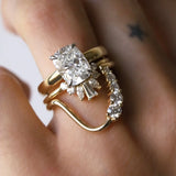 White diamond cushion engagement ring with two stacking bands