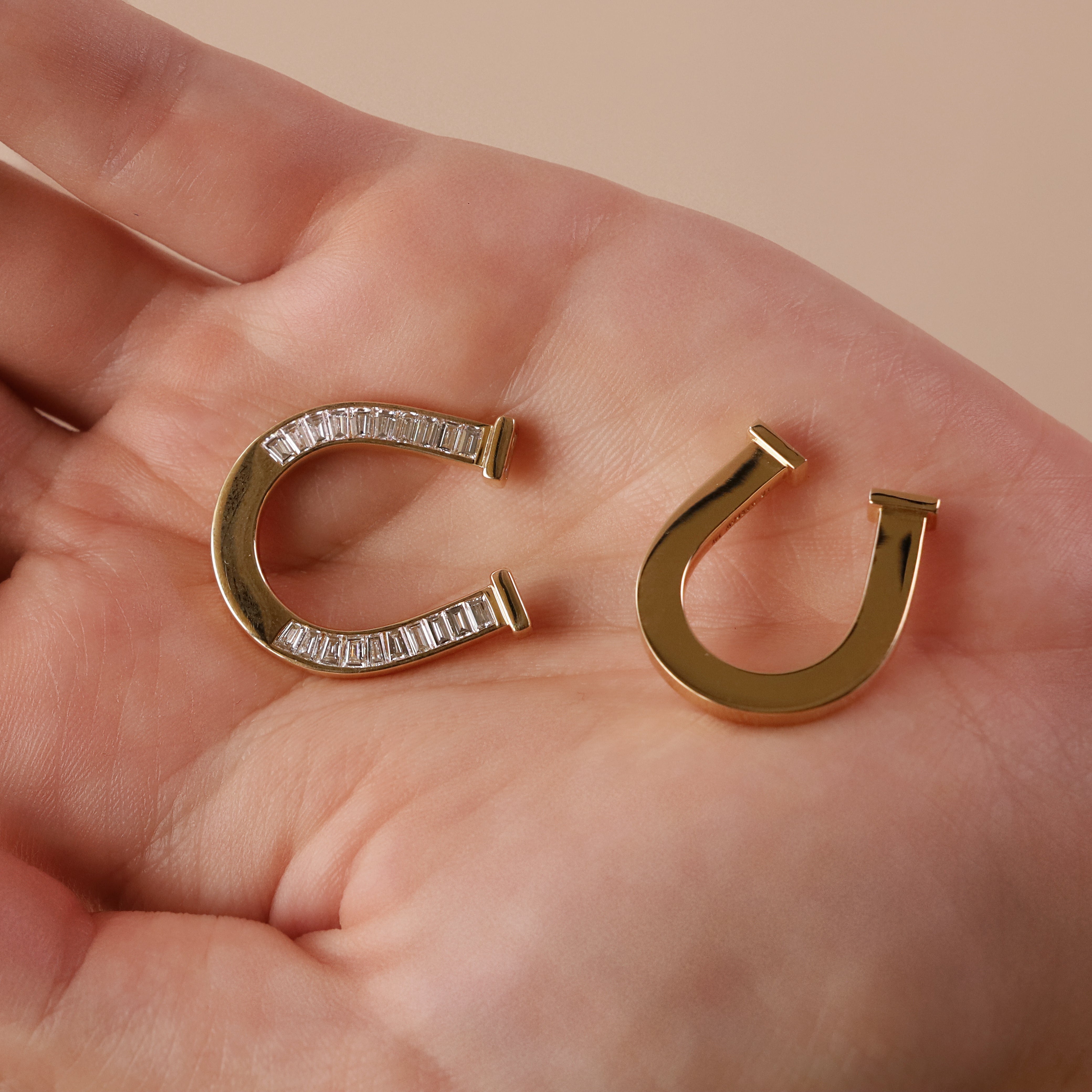 one of a kind horseshoe ring with baguette diamonds and gold horseshoe ring side-by-side
