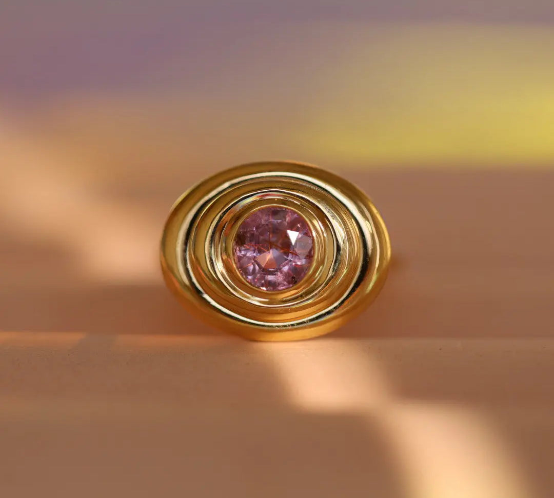 Flat lay of 1.50ct Pink Sapphire In-Orbit Ring