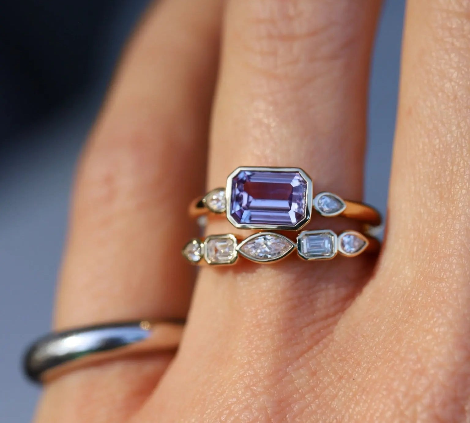 Close up of 1.59ct Sapphire and Diamond Ring with Tracer Band on hand