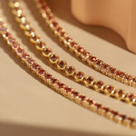 1.86tcw Orangish / Red Sapphire Tennis Bracelet [flat lay]