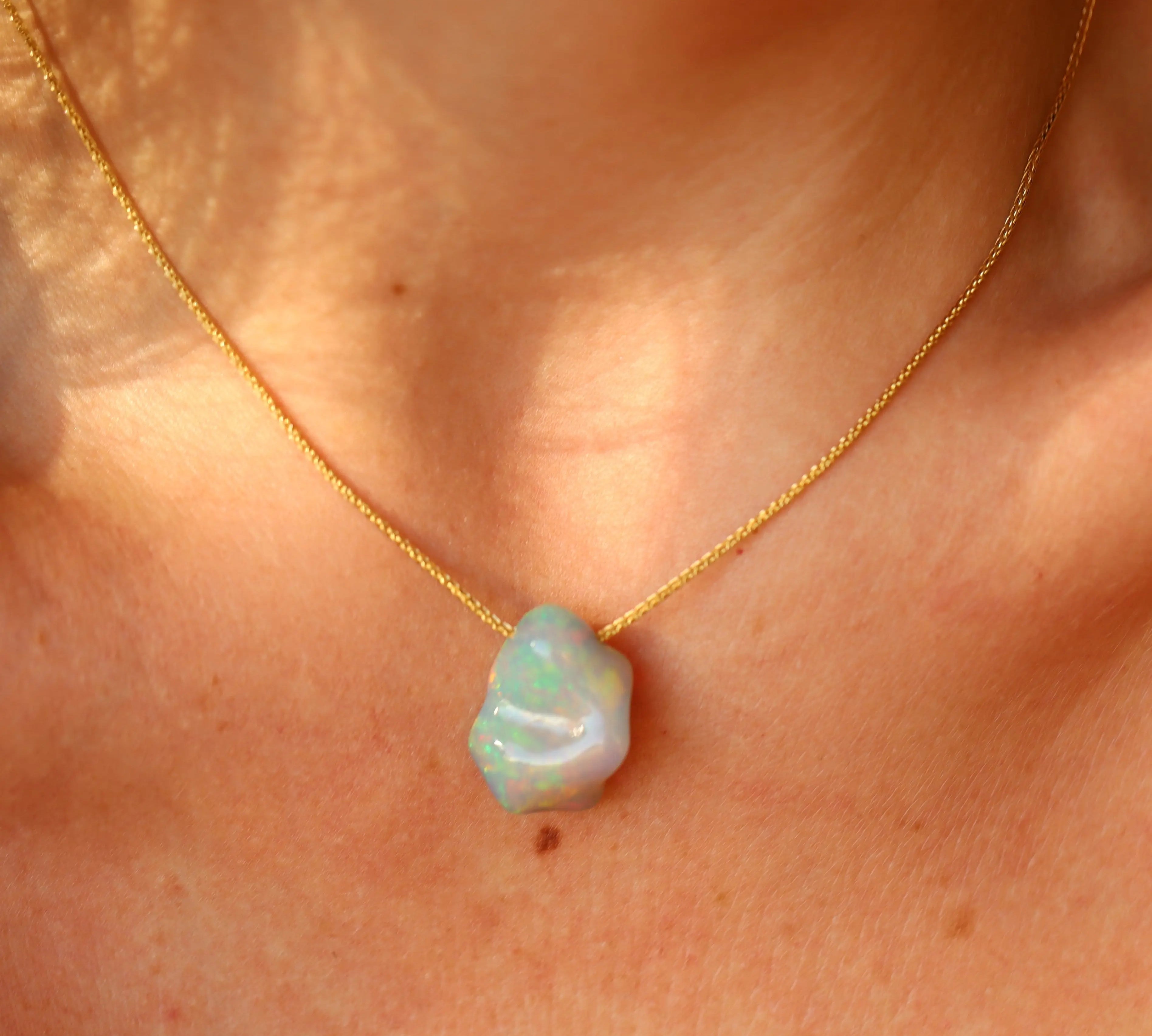10.41ct Mexian Blue Opal Freeform Necklace on a persons neck