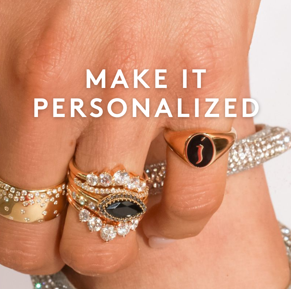 close up of woman's hands with stacks of Marrow Fine rings on fingers