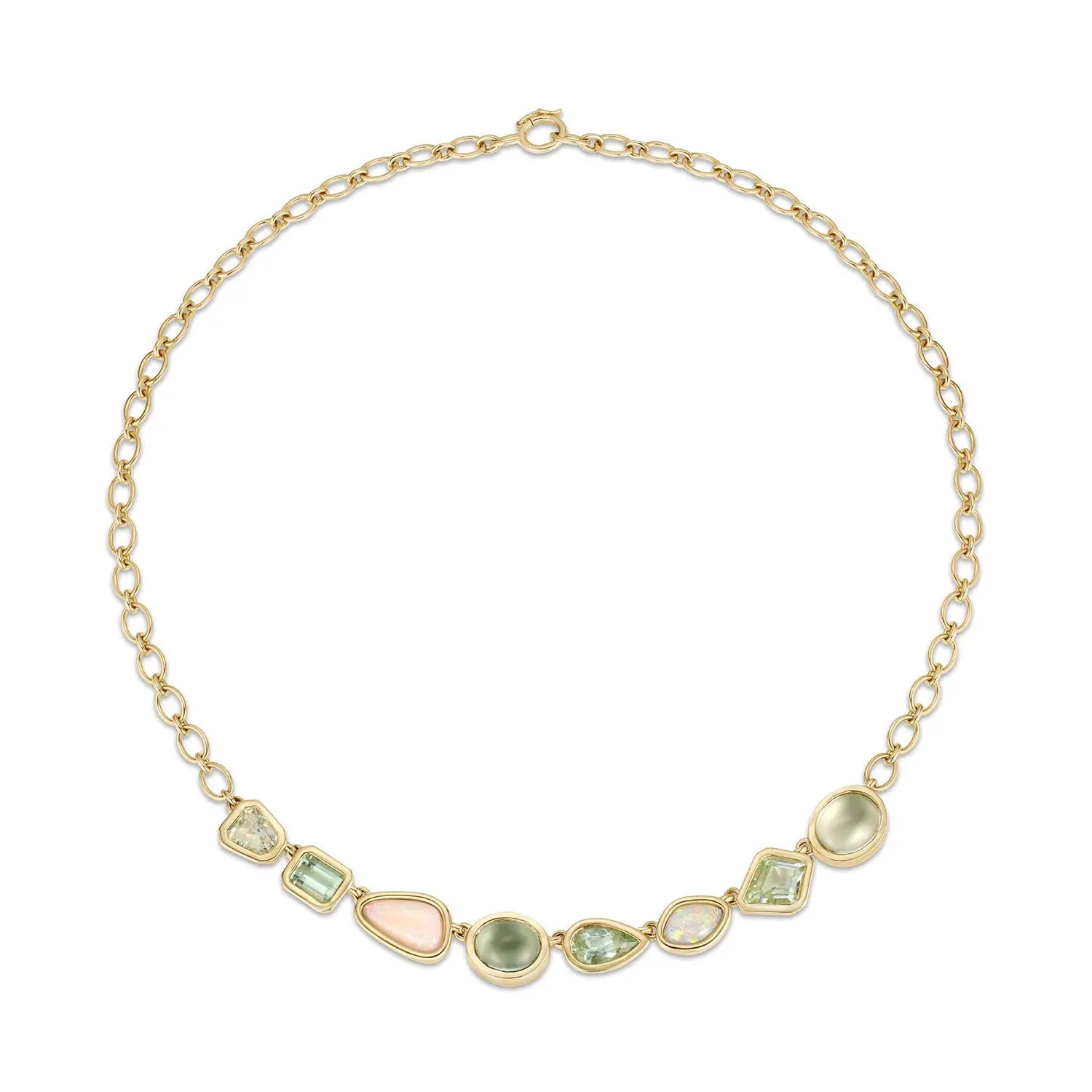Gold necklace with green and pink gemstones on a white background