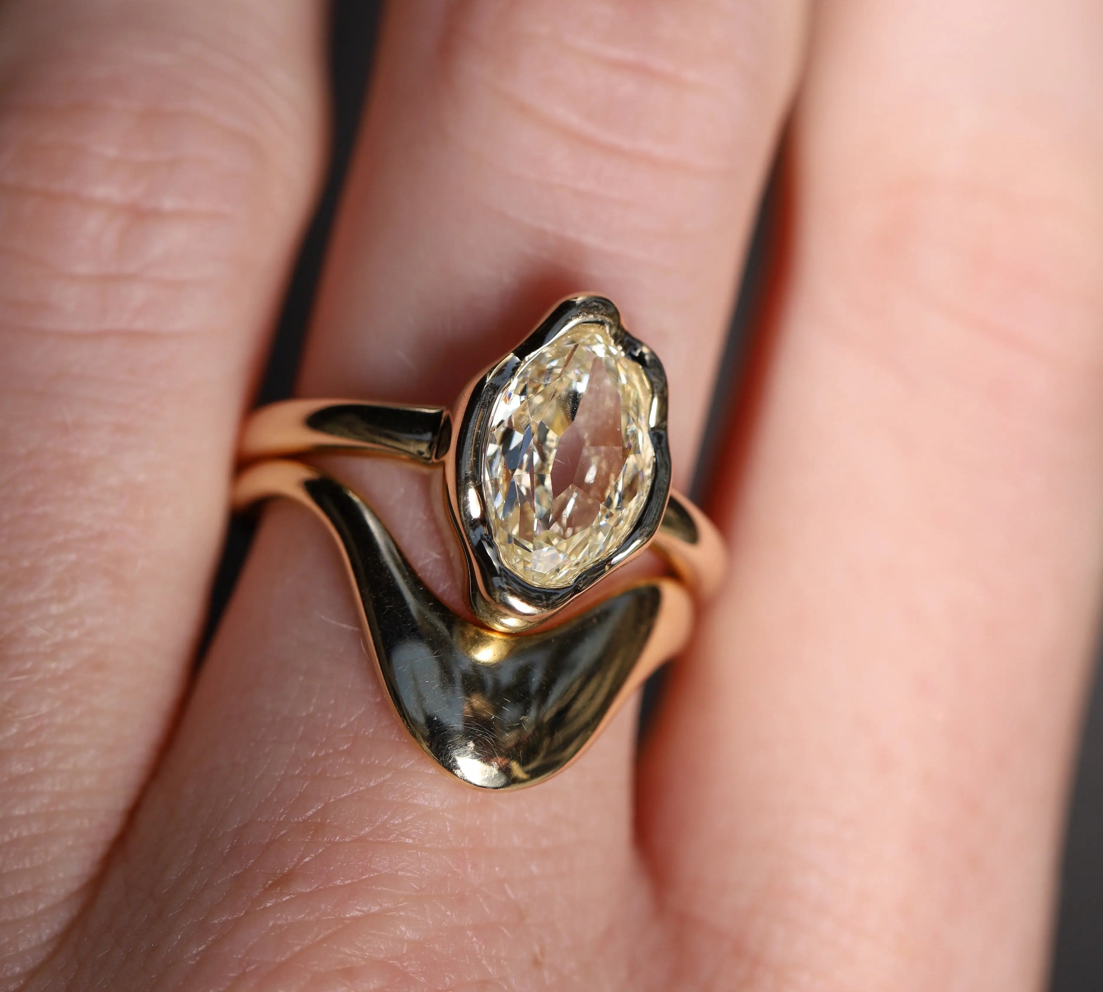 2.01ct Moval Diamond Abstract Bezel Ring on hand