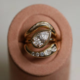 Gold ring with a diamond on a pink cushion