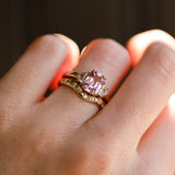 2.20ct Pink Sapphire and 0.44tcw Cadillac Diamond Three Stone Ring on hand