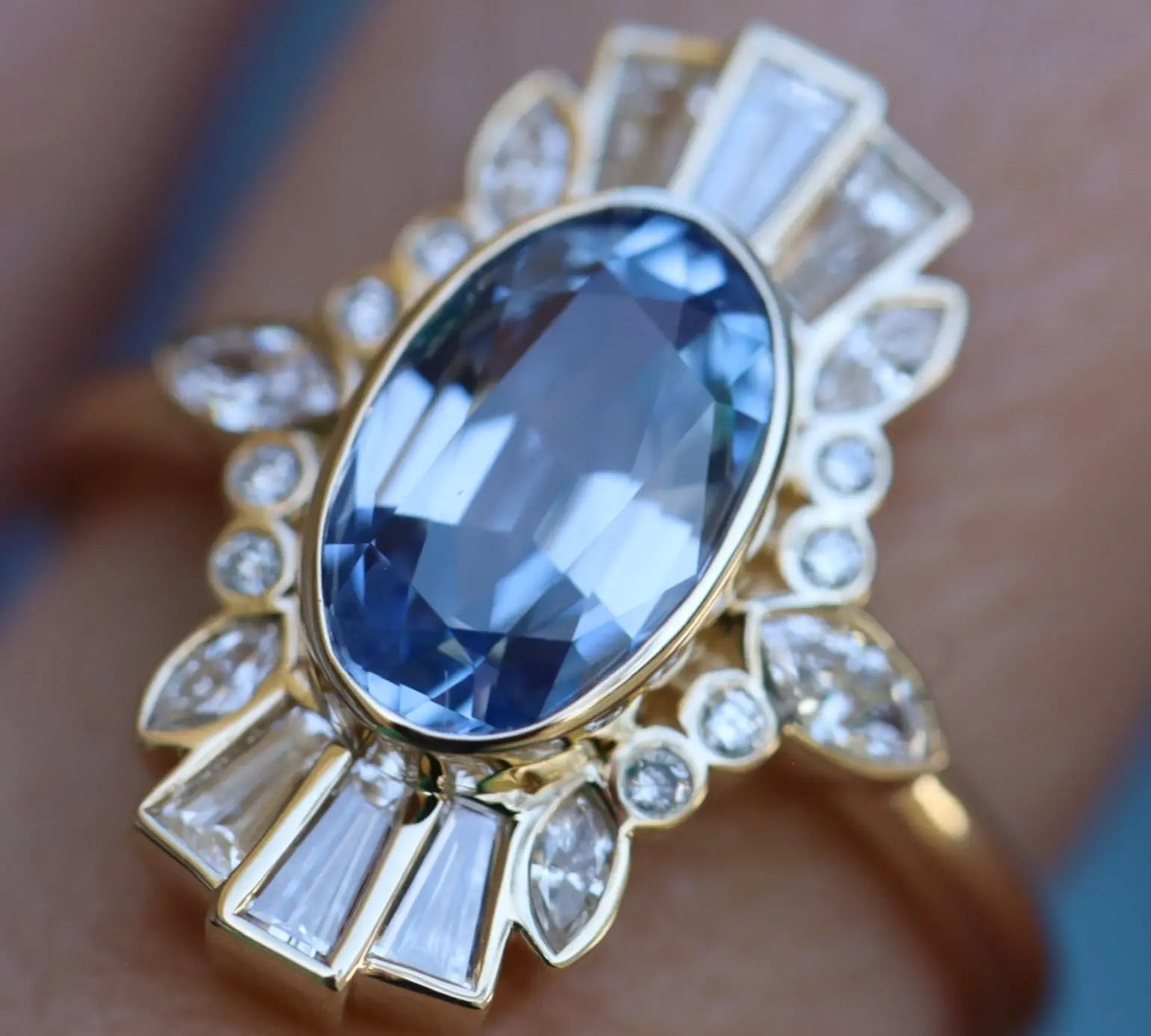 Close up of 2.26ct Sapphire Ballerina Ring on finger
